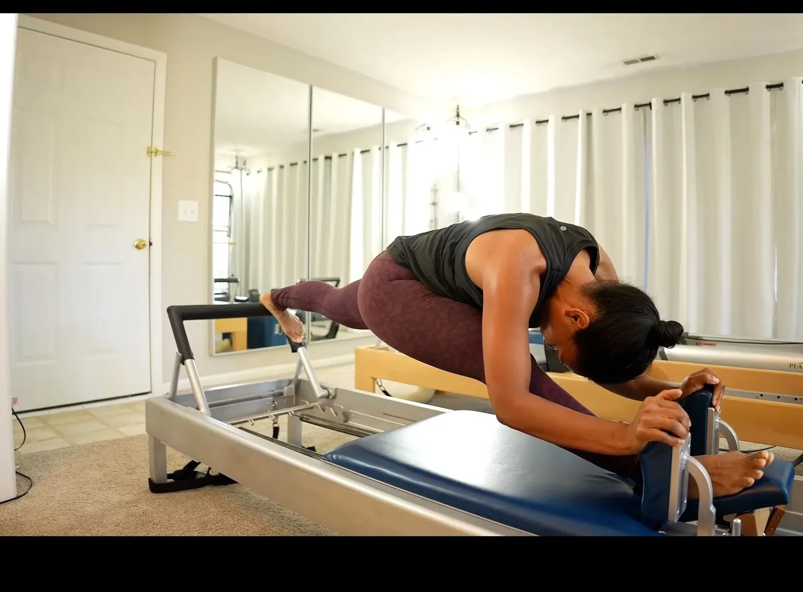 Classical Pilates on the reformer at Porch Pilates in Cary, NC